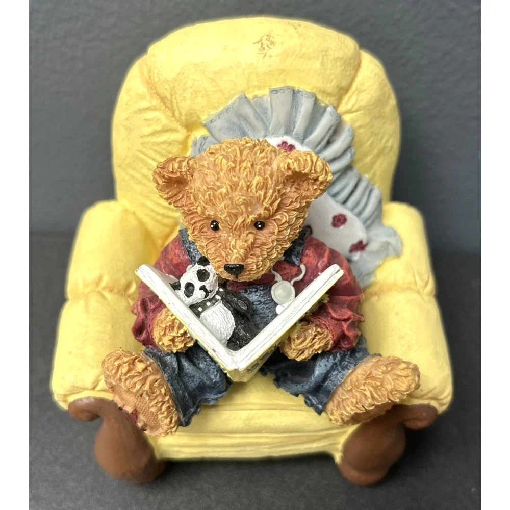 Baby Bear Sitting In Yellow Chair Reading Book With Stuffed Animal Toy Figurine